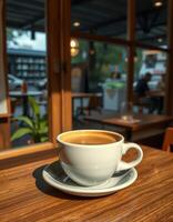 Warm coffee in a cozy cafe setting with soft light and people in the background photo