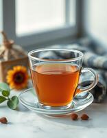 Relaxing afternoon tea with a warm cup in a cozy setting near a sunlit window photo