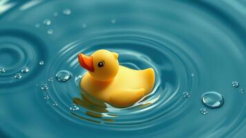 Rubber duck floats gently on calm water while creating ripples and bubbles photo