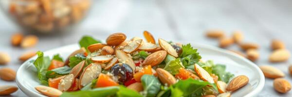 Fresh green salad with almonds, vegetables, and herbs served in a bowl on a wooden table photo