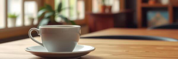 Enjoying a warm cup of coffee at a cozy cafe during a quiet morning photo