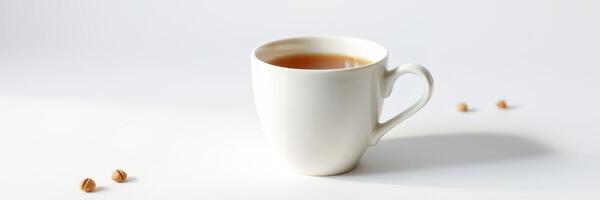 Warm cup of tea on a minimalist table with scattered tea leaves in a bright and serene setting photo
