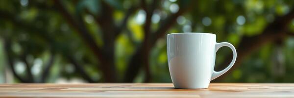 Coffee cup resting on a wooden table surrounded by lush greenery during a serene morning photo