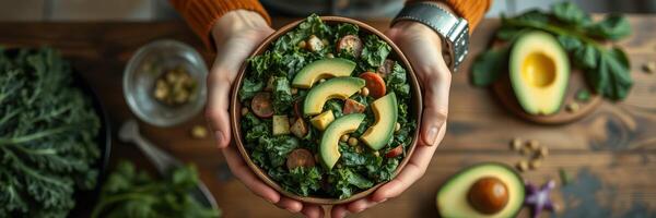 Fresh kale salad with avocado and nuts prepared in a cozy kitchen setting during autumn photo
