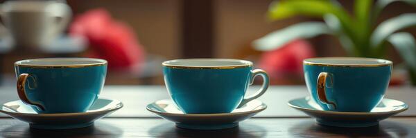 Exquisite collection of turquoise teacups displayed elegantly on a wooden table in a cozy cafe setting photo