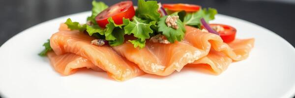 Fresh salmon slices served with salad on a white plate showcasing healthy cuisine options in a modern dining environment photo