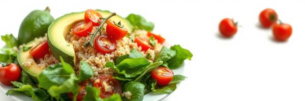 Fresh salad with avocado, cherry tomatoes, and leafy greens garnished on a white plate during daytime photo