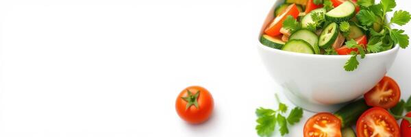 Fresh vegetable salad with cherry tomatoes and cucumbers served in a white bowl on a bright background photo