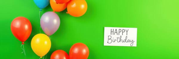 Colorful balloons and birthday greeting card create festive atmosphere for celebration photo