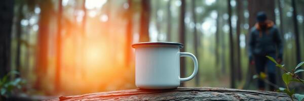 Enjoying coffee in a serene forest setting during sunrise with warm light filtering through the trees photo