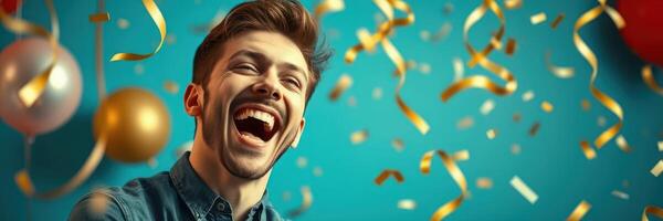 Man laughing joyfully under colorful confetti during a celebration with party decorations in the background photo