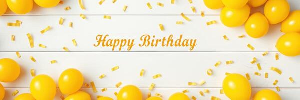 Colorful yellow balloons and confetti create a cheerful birthday celebration atmosphere for a joyful occasion photo