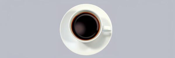Freshly brewed coffee nestled in a white cup on a smooth gray background photo