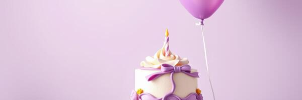 Colorful birthday cake with a candle and a balloon at a festive celebration photo