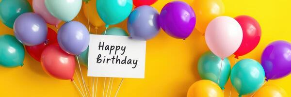 Colorful balloons and a birthday sign create a festive atmosphere for a celebration event photo