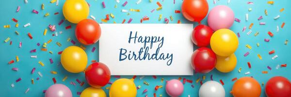 Colorful birthday celebration with balloons and confetti against a bright blue background photo
