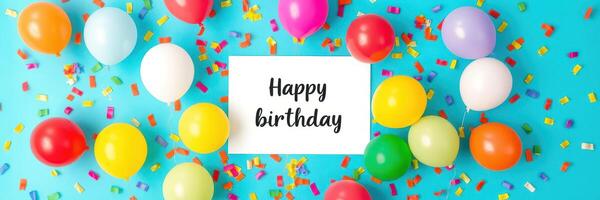 Colorful birthday celebration decorations with balloons and confetti on bright blue background photo