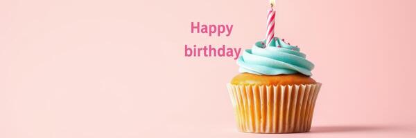 Celebrate with a pastel blue frosted cupcake topped with a candle and cheerful birthday wishes photo