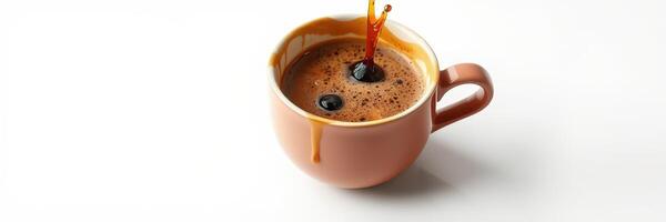 Hot coffee being poured into a brown cup with rich crema on top in a minimalist setting photo