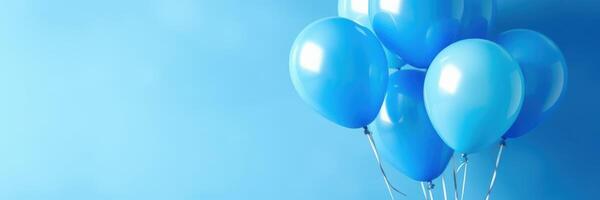 Blue balloons create a festive atmosphere against a soft blue backdrop for celebrations or events photo