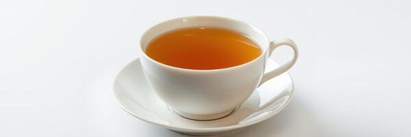 Delicate white cup filled with steaming herbal tea resting on a saucer against a clean white background photo