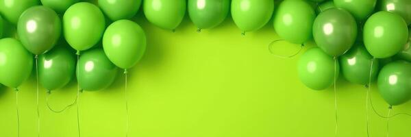 Green balloons arranged on a vibrant backdrop for a festive celebration or event decoration photo