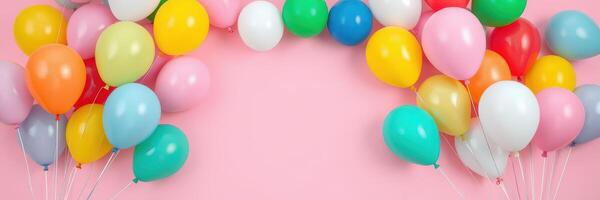 Festive arrangement of colorful balloons arching over a pink background perfect for celebrations and parties photo