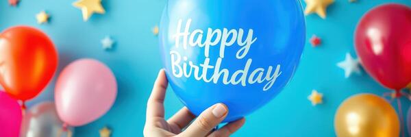 Birthday celebration with colorful balloons and a blue balloon displaying happy birthday message photo