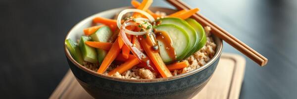 Delicious bowl of rice topped with fresh vegetables and savory sauce in a cozy setting photo