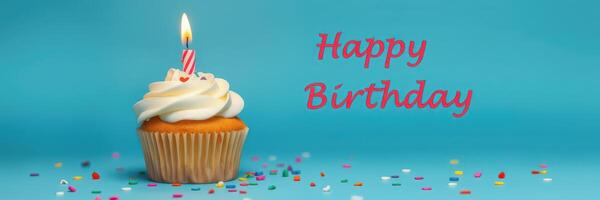Birthday cupcake with candle and colorful sprinkles on a blue background celebrating a festive occasion photo