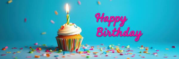 Colorful birthday cupcake with candle and festive decorations adds joy to the celebration atmosphere photo