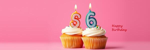Celebrate a special birthday with colorful cupcakes featuring number candles on a vibrant pink background photo