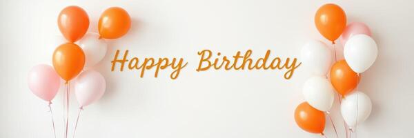 Celebration with orange and white balloons and a birthday message on a wall photo