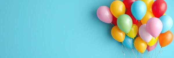Colorful balloons floating against a bright blue background, perfect for celebrations and parties with joyous atmosphere photo