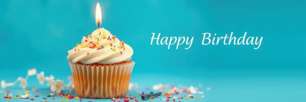 Colorful birthday cupcake with a candle and festive decorations for a joyful celebration photo