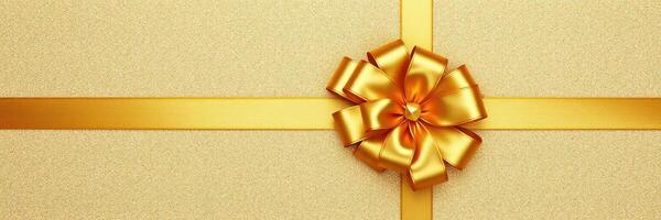 Gift box with golden ribbon and bow on a textured golden background showcasing elegance and celebration photo