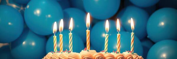 Celebration of a birthday with a cake adorned with candles and blue balloons in the background photo