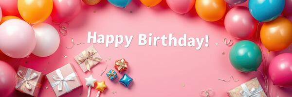 Colorful birthday celebration setup with balloons, gifts, and cheerful decorations on a pink background photo