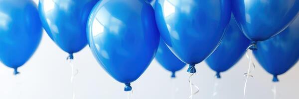 Bright blue balloons float against a light background, creating a festive and cheerful atmosphere for celebrations indoors photo