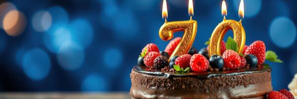 Celebratory birthday cake with colorful candles and berries for a 70th anniversary gathering photo