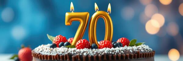 Celebration of a 70th birthday with a beautifully decorated chocolate cake topped with candles and fresh berries photo