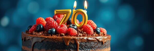 Celebratory chocolate cake adorned with candles and fresh berries for a special 70th birthday occasion photo