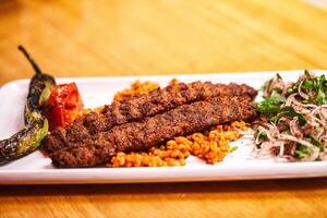 Turkish adana kebab with vegetables photo