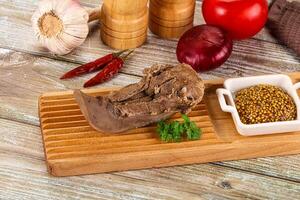 Steamed pork tongue with mustard photo