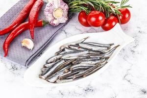 Pickled anchovy in the plate photo