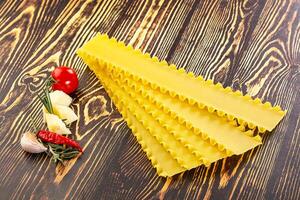 Uncooked raw Lasagna dry sheets photo