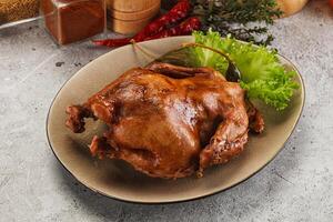 Baked small chicken with spices photo