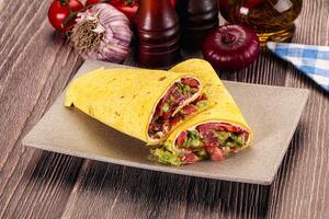 Burrito with tuna and vegetables wrap photo