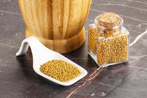 Mustard dry seeds in the bowl photo