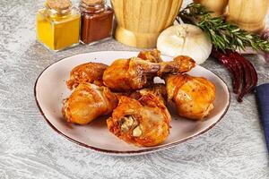 Raw marinated chicken drumstick for cooking photo